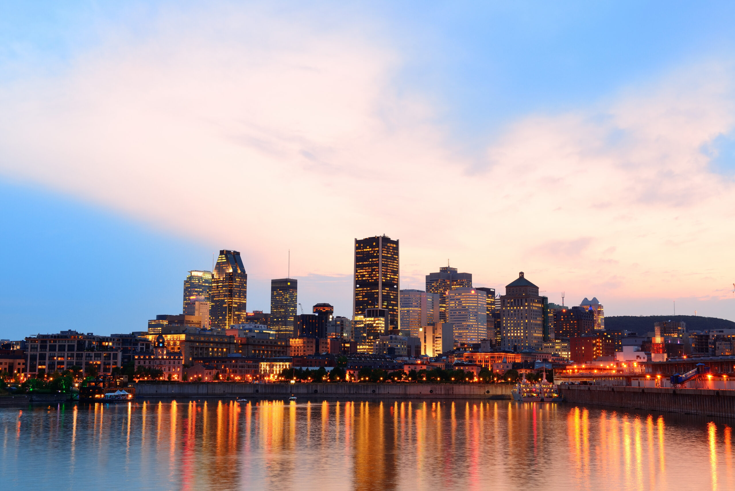 https://pinnaclefundservices.com/wp-content/uploads/2026/02/montreal-river-sunset-with-city-lights-urban-buildings-scaled.jpg